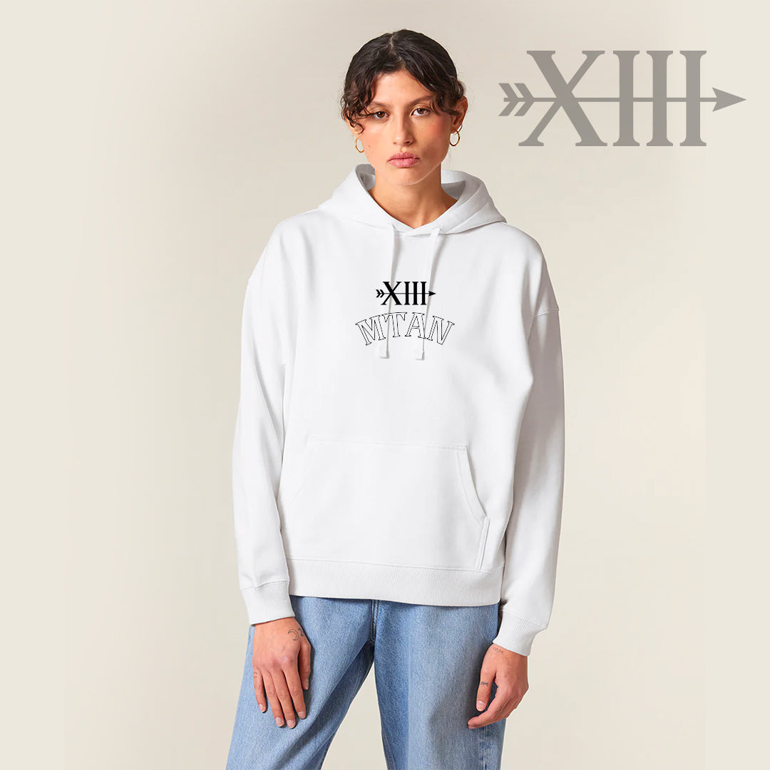 Woman wearing Rise Again white hoodie with a logo on a beige background