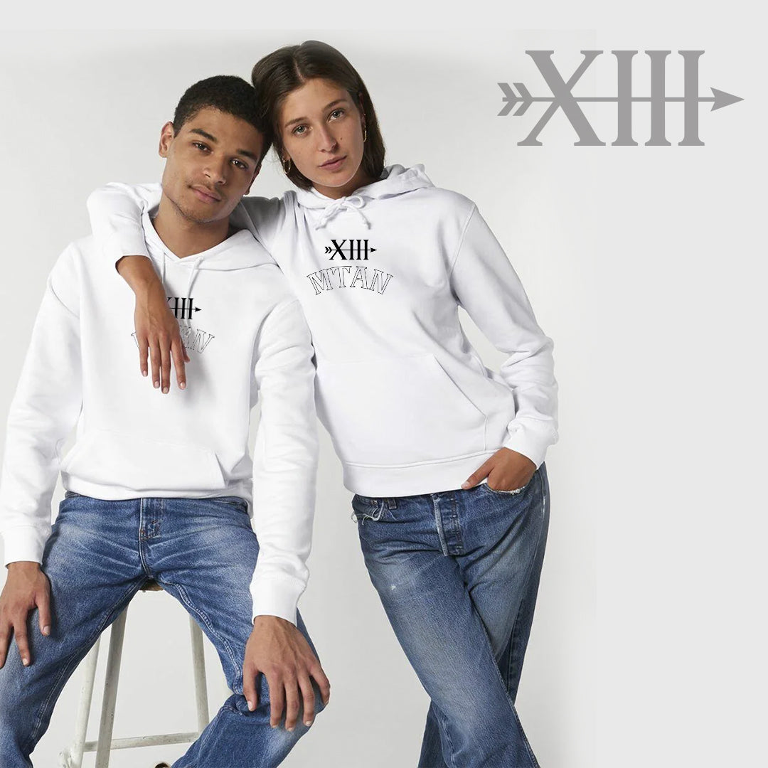 Two people wearing white hoodies with a brand logo on a plain background